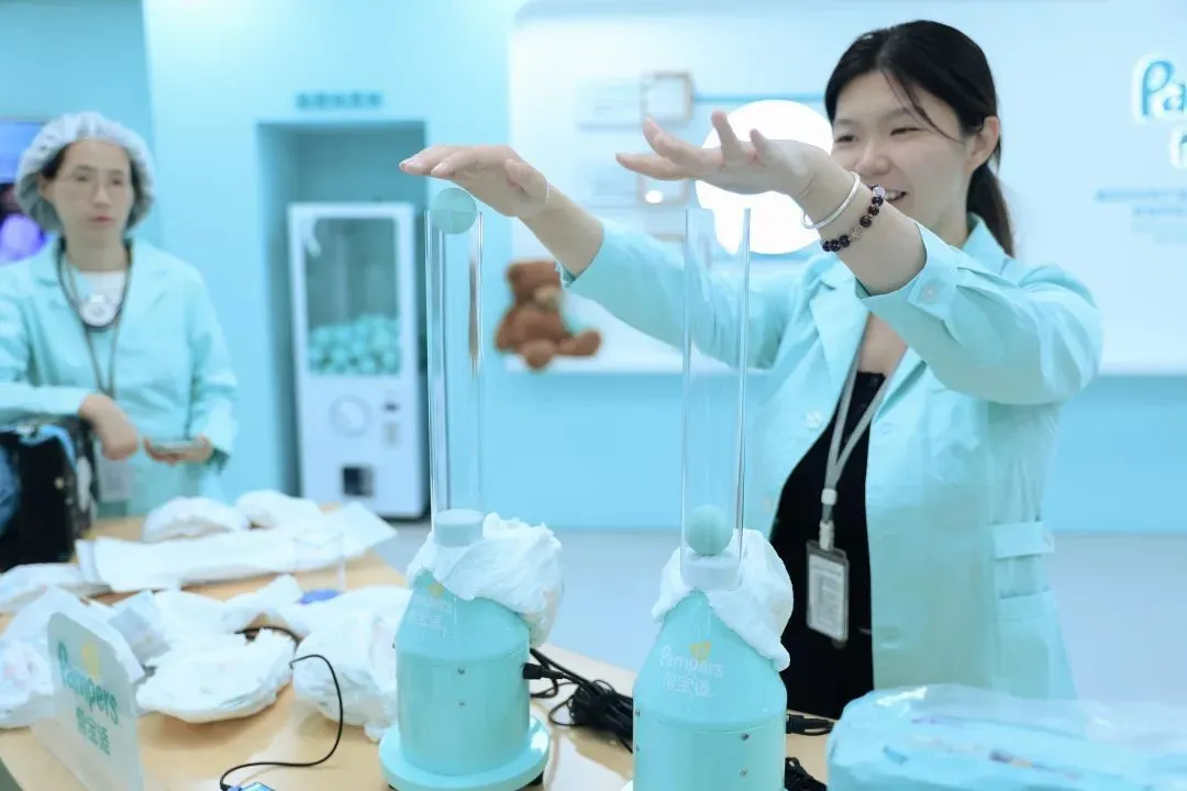 A lab technician demonstrates product features in the Pampers lab